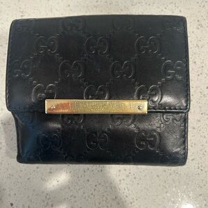 Gucci Black Embossed GG Leather Wallet with Gold Bar Accent